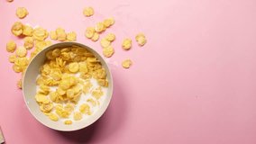 A blue bowl has tipped over, spilling cereal and milk  - Powered by Shutterstock - Get 15% off with code: PIKWIZARD15