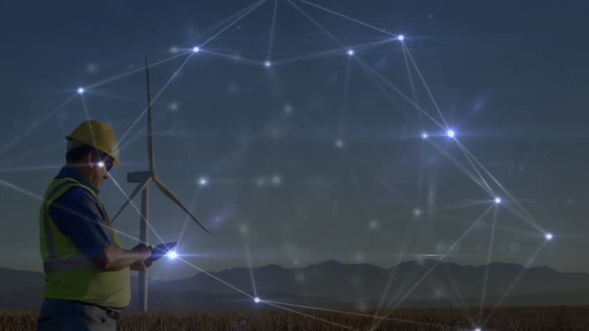 Male technician using tablet in wind farm at dusk, showcasing energy technology network graphics. Renewable, energy, industry, digital, technology, outdoors, infrastructure - Powered by Shutterstock - Get 15% off with code: PIKWIZARD15