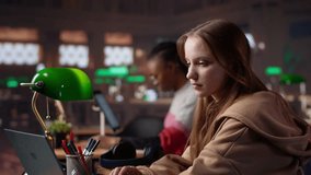 Girl shares a high five with her african american colleague at the library, receiving high grades on a group assignment at school. Pleased clever pupils celebrating academic success. Camera A. - Powered by Shutterstock - Get 15% off with code: PIKWIZARD15