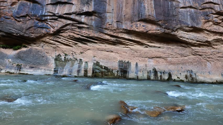 Static tight shot of a section of sandstone rock wall on Zion National Park
