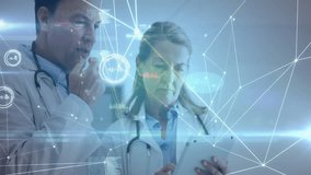 Senior doctors standing in clinic, reviewing laptop data with stethoscopes and network graphs. Medical, technology, innovation, healthcare, analysis, professionalism, digital - Powered by Shutterstock - Get 15% off with code: PIKWIZARD15