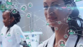 Female doctor analyzing patient network icons in health clinic wearing stethoscope and coat. Medical, technology, professional, innovation, healthcare, digital, wellness - Powered by Shutterstock - Get 15% off with code: PIKWIZARD15