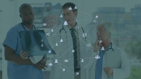 Medical team examining X-ray by window, showcasing telemedicine with network icons overlay. Healthcare, collaboration, digital, professionalism, clinical, technology, teamwork - Powered by Shutterstock - Get 15% off with code: PIKWIZARD15