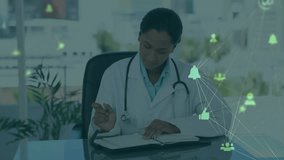 Doctor with stethoscope writing notes in clinic with green network icons connecting avatars, bells. Medical, professional, modern, healthcare, technology, knowledge, patient care - Powered by Shutterstock - Get 15% off with code: PIKWIZARD15