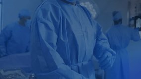 lead surgeon guiding surgery in operating room, displaying neon-blue circuit overlay on monitors. Medical, innovation, futuristic, teamwork, technology, healthcare, precision - Powered by Shutterstock - Get 15% off with code: PIKWIZARD15