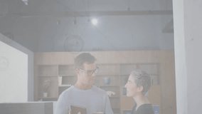 Colleagues using tablets in modern business workspace, showing animated network profile icons. Collaboration, networking, technology, professional, workspace, innovation, digital - Powered by Shutterstock - Get 15% off with code: PIKWIZARD15