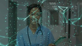 Female nurse reviewing tablet data in medical corridor, showing nodes, lines and globe. Healthcare, technology, innovation, connectivity, professional, futuristic, diagnostic - Powered by Shutterstock - Get 15% off with code: PIKWIZARD15