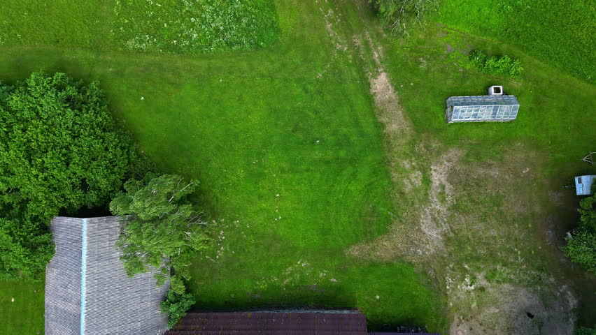 Cutting grass on a riding mower in a circular or bull