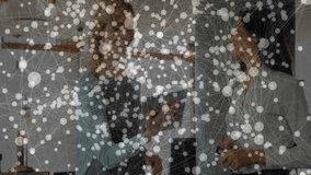 Office colleagues holding tablet and phone discussing business tech with network nodes hovering. Professional, collaboration, communication, technology, networking, modern, workspace - Powered by Shutterstock - Get 15% off with code: PIKWIZARD15