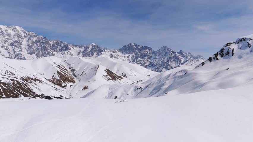 Ski Mountaineers Trekking On Snow Winter Caucasus Mountains In Svaneti Region, Georgia. Aerial Drone Shot