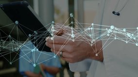 Male doctor operating tablet with stethoscope in clinic, displaying glowing network data visuals. Medical, technology, futuristic, data, healthcare, analysis, innovation - Powered by Shutterstock - Get 15% off with code: PIKWIZARD15