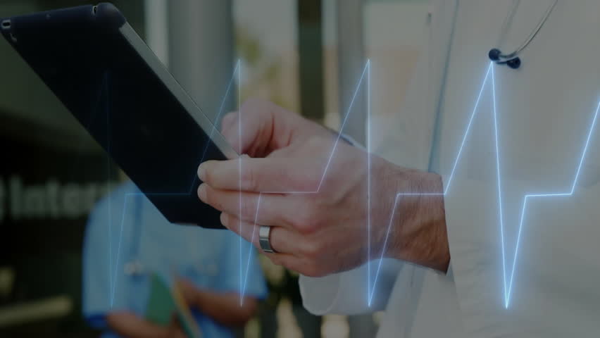 Male doctor holding and tapping tablet in medical clinic room, with ECG waveform graphic overlay. Medical, healthcare, technology, diagnostic, professional, clinical, digital
