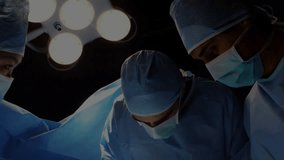 Surgical team performing surgery in operating room, displaying green digital network overlay. Medical team, healthcare, innovation, high-tech, precision, teamwork, clinical - Powered by Shutterstock - Get 15% off with code: PIKWIZARD15