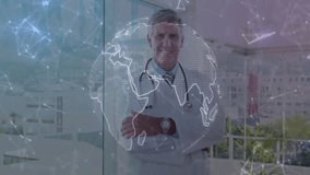 Senior male doctor standing by glass windows in clinic, showing stethoscope and network overlay. Professional, innovation, connectivity, healthcare, modern, technology, leadership - Powered by Shutterstock - Get 15% off with code: PIKWIZARD15