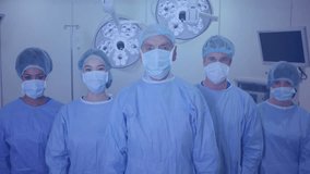 Medical team standing in operating room under surgical lights, displaying animated waveform overlay. Health, teamwork, innovation, diagnostics, professionalism, healthcare, precision - Powered by Shutterstock - Get 15% off with code: PIKWIZARD15