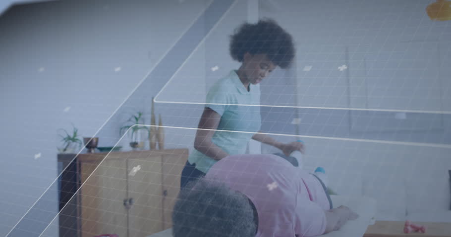 Female therapist providing physical therapy to senior patient, with floating holographic panels. Wellness, rehabilitation, futuristic, healing, healthcare, relaxation, interior