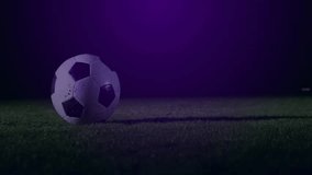 Soccer ball resting on green turf, shining under stadium lights and animated overlay graphics. Sports equipment, outdoor activity, futuristic design, digital art, athletic training, entertainment, - Powered by Shutterstock - Get 15% off with code: PIKWIZARD15
