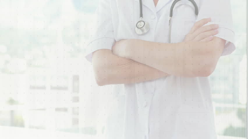 female doctor standing in bright medical clinic, displaying animated bar charts and ECG waveforms. Medical, diagnostics, healthcare, analysis, technology, clinical, professional - Powered by Shutterstock - Get 15% off with code: PIKWIZARD15