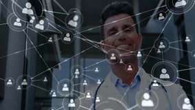 Male doctor wearing stethoscope and lab coat smiling in medical lobby, showcasing network icons. Professional, healthcare, technology, innovation, modern, connectivity, communication - Powered by Shutterstock - Get 15% off with code: PIKWIZARD15