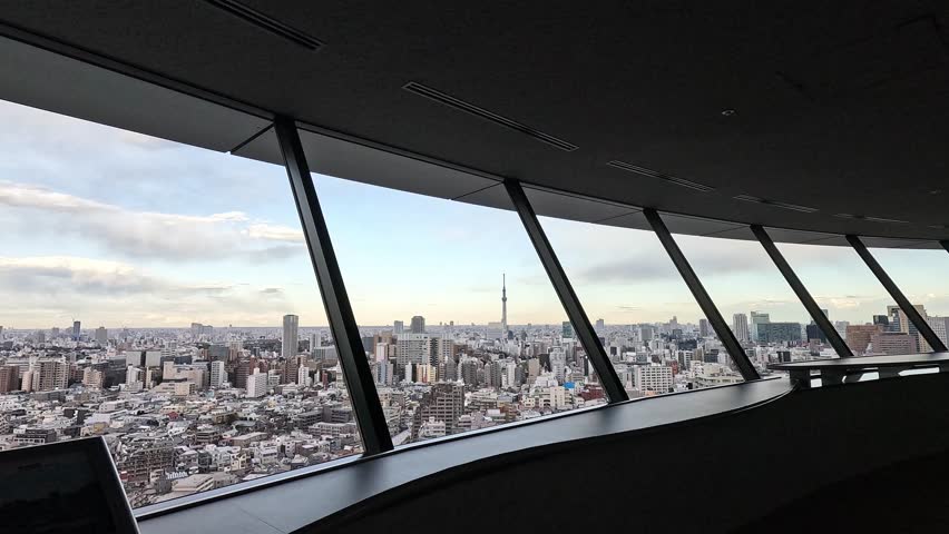 bunkyo civic center framed panoramic view of the Skyline of Tokyo with Tokyo Skytree. Opening shot revealing the full view.