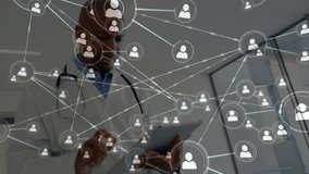 Male doctor using tablet in clinical environment, showcasing user-profile network graphics. Healthcare, telemedicine, technology, professionalism, connectivity, innovation, digital - Powered by Shutterstock - Get 15% off with code: PIKWIZARD15