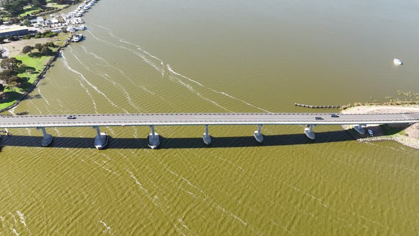 Goolwa, South Australia – 4K Aerial Drone Footage Showcasing the Murray River Bridge, Waterfront Homes, Boats, and Scenic Views of the Historic Riverside Town Near the Coorong National Park