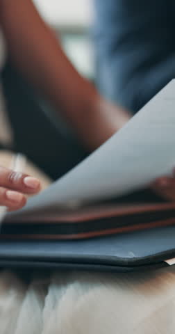 Document, reading and hands of person at interview for resume application, documents and hiring checklist. Paperwork, meeting and survey with closeup of applicant in lobby for job search and vacancy