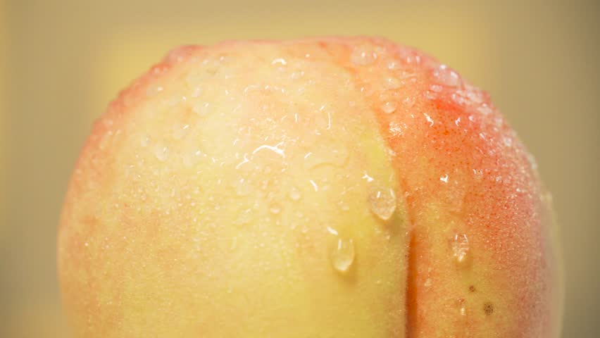Closeup of juicy Yangshan peach highlighting summer freshness in a bright, sunny setting