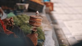 Close-Up of Hand Spinning Tibetan Prayer Wheel - Powered by Shutterstock - Get 15% off with code: PIKWIZARD15
