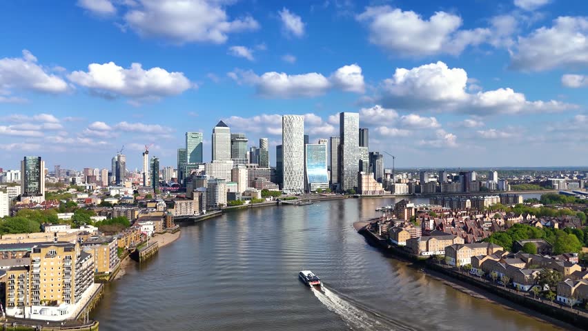 Aerial view of the financial district Canary Wharf and the Docklands in London, England, during a sunny day