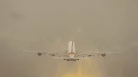 Four engine airliner taking off into cloudy sky with minimal visibility and thick haze. Large passenger aircraft climbing through foggy atmosphere after liftoff. Wide body jet ascending in stormy - Powered by Shutterstock - Get 15% off with code: PIKWIZARD15
