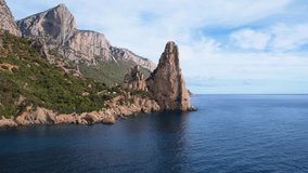 Aerial drone view of cliffs of Punrta Pedra Longa on Sardegna. Warm turquoise sea, height rocks and beach with green mountains on the Sardinia island. - Powered by Shutterstock - Get 15% off with code: PIKWIZARD15