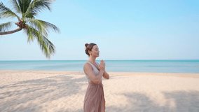Concentrated calm young yoga woman with closed eyes and praying hands focus on meditating on sandy beach by seashore, stress relief and mindfulness, healthy lifestyle  - Powered by Shutterstock - Get 15% off with code: PIKWIZARD15