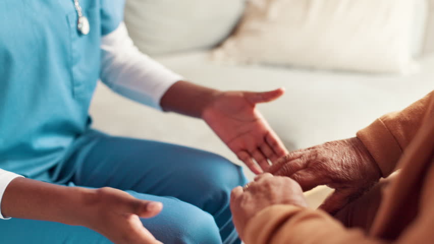 Support, help and nurse holding hands with patient on sofa for medical diagnosis with empathy. Trust, consultation and caregiver with person in nursing home for compassion, kindness or connection.
