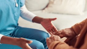 Support, help and nurse holding hands with patient on sofa for medical diagnosis with empathy. Trust, consultation and caregiver with person in nursing home for compassion, kindness or connection. - Powered by Shutterstock - Get 15% off with code: PIKWIZARD15