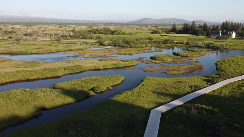 Beautiful lake in Iceland surrounded by volcanic landscapes, reflecting sky and nature, perfect for travel, nature, and adventure themes