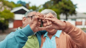 Face, heart and senior couple with gesture, outdoor and romance for elderly people, commitment and love. Smile, old man and bonding with woman, relationship and happy for retirement, care or Canada - Powered by Shutterstock - Get 15% off with code: PIKWIZARD15