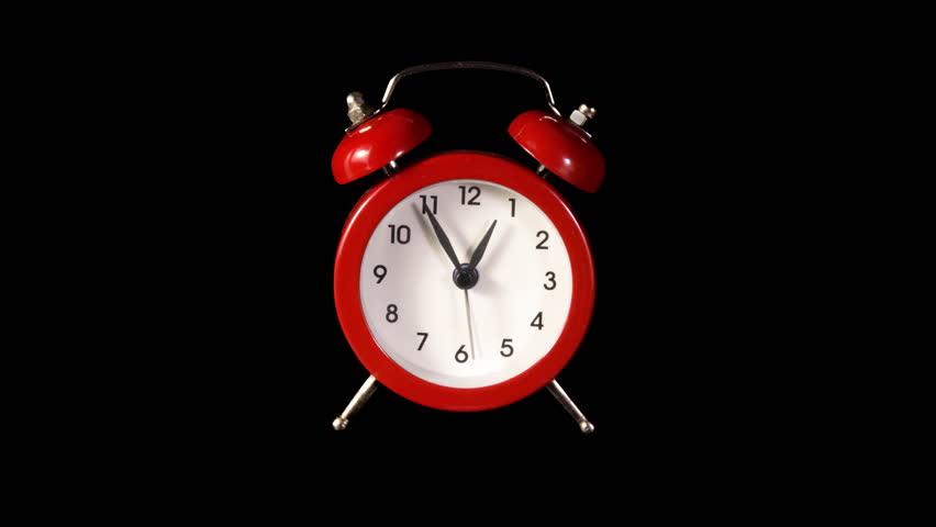 Alarm Clock Time Lapse on a Black Background. Fast Movement of Clock Hands Motion Blur. Red Analog Clock Isolated with Running Time Passing Fast. Hurry Up Time Reminder. Last Minute Offer