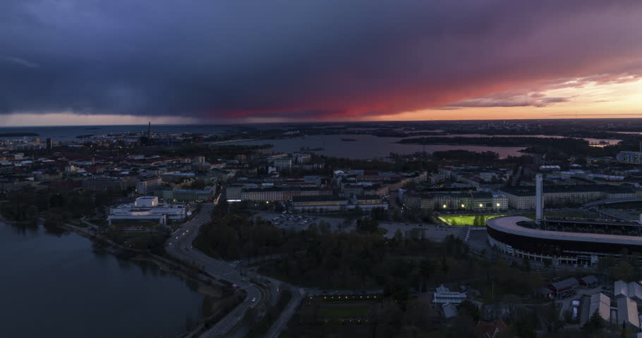 Aerial time-lapse of dark, rain clouds moving over the Toolo district in Helsinki
