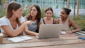 Group of female students, high school pupils gather at University campus, working together on creative task, prepare for final exams using laptop. Girl friends team  - Powered by Shutterstock - Get 15% off with code: PIKWIZARD15