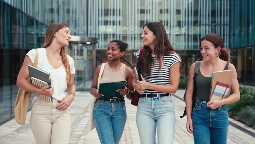 University students walking outside the Economics and Business Administration Faculty building