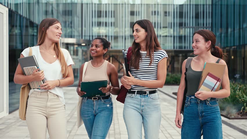 University students walking outside the Economics and Business Administration Faculty building