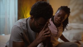 Family support African American ethnic married couple relationship problems caring woman wife apologizing after fight ask forgiveness quarrel calming depressed husband man at home bedroom late evening - Powered by Shutterstock - Get 15% off with code: PIKWIZARD15