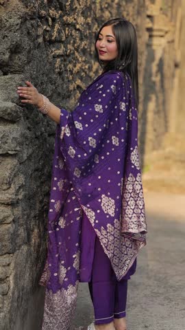 Elegant Woman in Traditional Indian Salwar Kameez Posing Outdoors