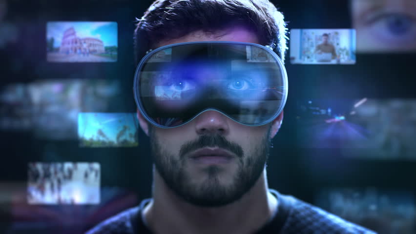 Futuristic Scene Of Caucasian Man Using High-Tech Headsets To Interact With Holographic Videos And Social Media Updates In Real Time.