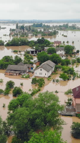Aerial view Floods and flooded houses. Mass natural disasters and destruction. A big city is flooded after floods and rains.