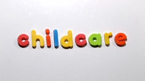Stop motion animation of fridge magnets moving to spell the word childcare