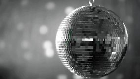 Large disco ball rendered in 3D rotating over gray blur, reflecting swirling violet particle trail. Luxury, nightlife, dynamic, futuristic, glamorous, abstract, vibrant - Powered by Shutterstock - Get 15% off with code: PIKWIZARD15