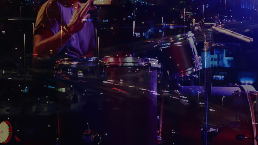 Male drummer playing drum kit under purple lights, overlaying urban light trails, music graphics. Music, performance, nightlife, urban, atmosphere, energy, rhythm