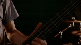 Male musician playing bass guitar in music technology studio, displaying green METAVERSE overlay. Musician, instrument, digital, futuristic, ambiance, creativity, performance - Powered by Shutterstock - Get 15% off with code: PIKWIZARD15